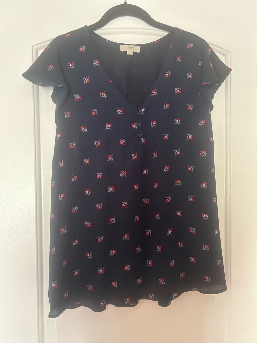 LOFT Navy V-Neck Flutter Sleeve Blouse with Red Floral Accents